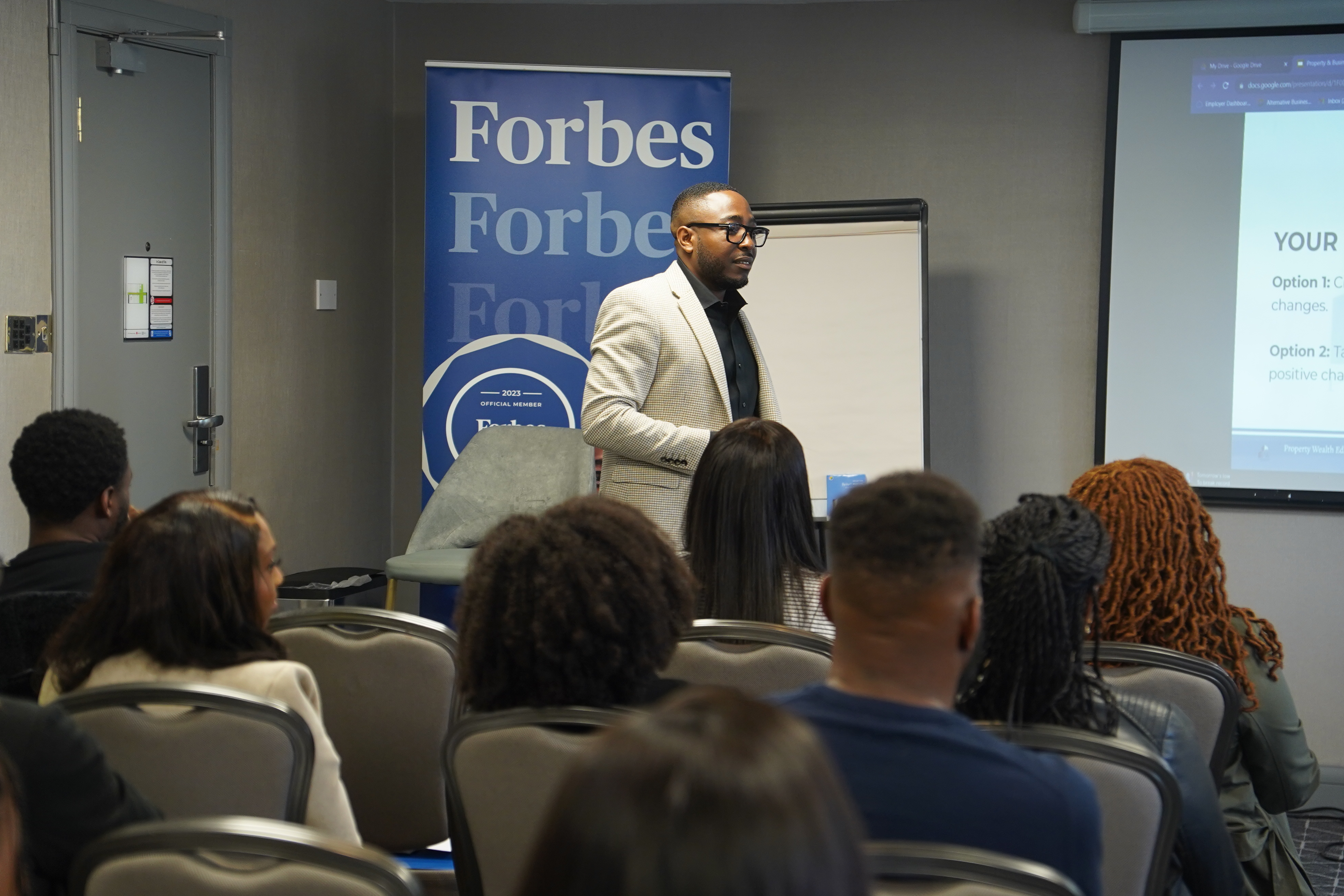 Dr Daniel Moses speaking at a property education event